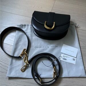 Charles & Keith Gabine Saddle Crossbody Bag with Gold Hardware